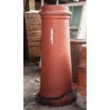 Terracotta tapering cylindrical chimney pot, height 39cm.