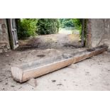 Old stained pine feeding trough, length approximately 304cm.