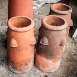 Small terracotta Pocket Beehive chimneys, height 62cm and two others similar, (3).