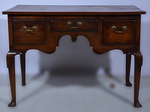 Victorian oak side table, rectangular boarded top, three frieze drawers with a shaped apron,