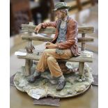 Capodimonte model of a Tramp with a Squirrel, width 28cm.