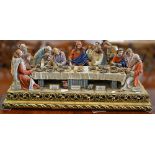 Large Capodimonte group, The Last Supper, set on a gilt composition plinth, overall width 84cm.