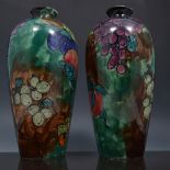 Pair of Samuel Hancock and Sons shouldered vases, decorated with fruit, designed by J X Abraham,