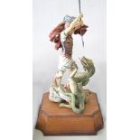 Hereford fine china group, St George and the Dragon, limited edition on a wooden plinth,