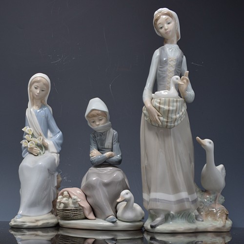 Lladro figure of a girl with a goose and a duck, 33cms and three other Lladro figurines, (4).