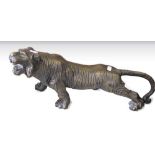 Cast metal model of a tiger, length 44cms.