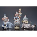 Lladro figure of a clown with balloons, 15cms and two other Lladro models of clowns, each boxed,