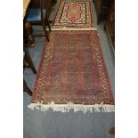 Afghan rug, with three rows eight guls on a red field, the border within guards, (worn),