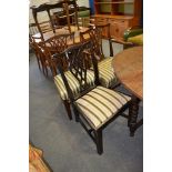 Set of four George III mahogany dining chairs, shaped crestings, pierced vase splats,
