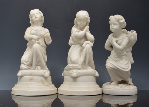 Pair of Parian Harvester figure spill vases, modelled as children with sheaths, 19cm,