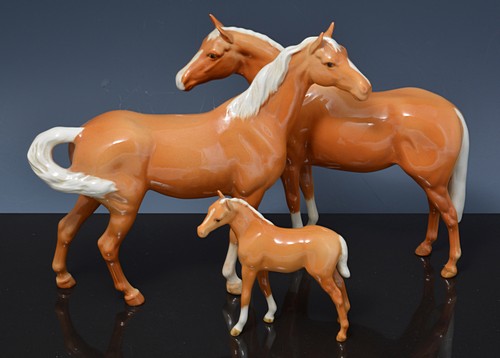 Beswick model of a Palamino horse, 21cms, two similar and a Beswick Palamino foals, (4).