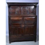 Joined oak court cupboard, basically 18th Century with a moulded cornice,