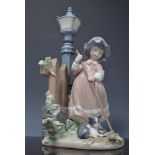 Lladro figure of a girl sweeping by  a lamp post with a kitten, 34cms, with a box.