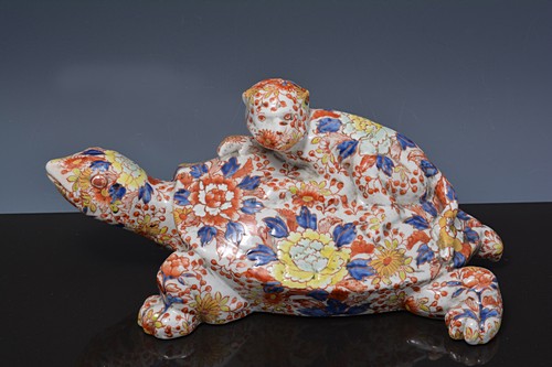 Chinese porcelain model of a turtle and monkey, length 35cms.