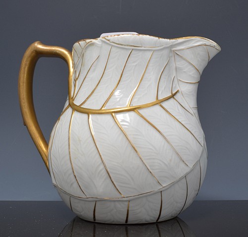 Wedgwood leaf-moulded pottery jug, 19th Century, gilt detail, (restored), 14cms.