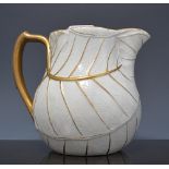 Wedgwood leaf-moulded pottery jug, 19th Century, gilt detail, (restored), 14cms.