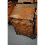 Old oak bureau on chest, slope front boarded bureau, enclosed a fitted interior with a shelf,