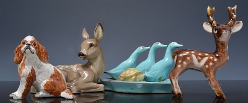 Collection of pottery animal models and other small models.