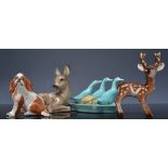 Collection of pottery animal models and other small models.