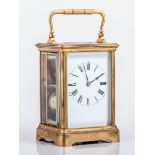 A French gilt metal carriage clock, by Henry Jacot, Paris, white enamel dial with Roman numerals,