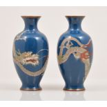 A pair of Chinese cloisonne blue ground ovoid vases, each decorated with a ferocious dragon, 12.5cm.