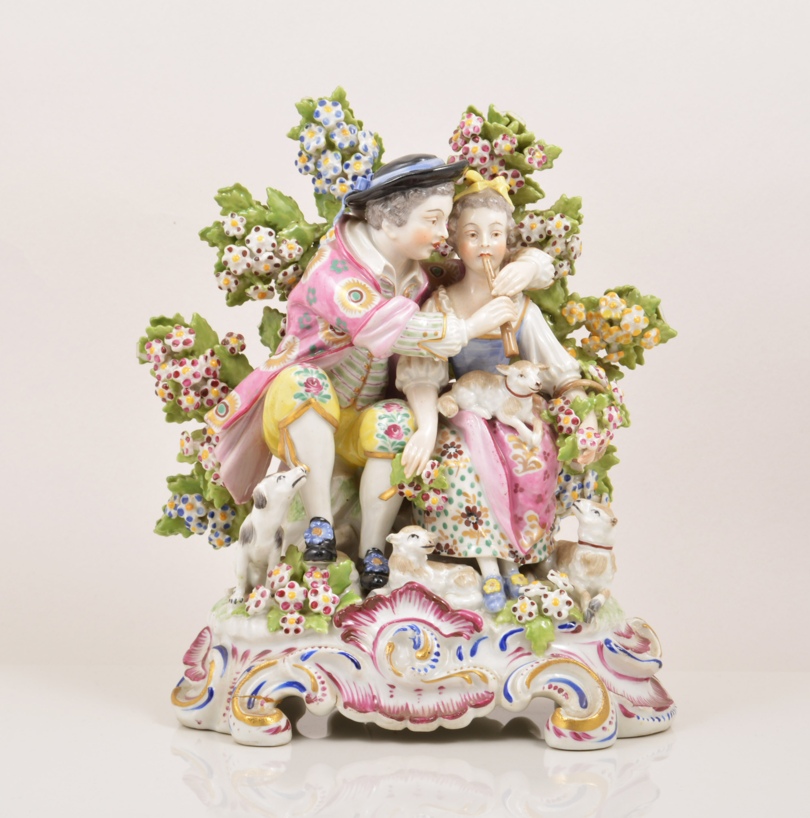 A Chelsea style porcelain bocage group, probably Samson, Paris, late 19th Century,