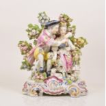 A Chelsea style porcelain bocage group, probably Samson, Paris, late 19th Century,