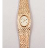 A lady's Omega dress watch, oval champagne baton dial,