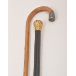 A light wood walking stick, with a silver terminal, London 1923, engine turned decoration,