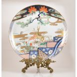 A Japanese porcelain charger, perhaps Meiji period, decorated with a stag and doe,