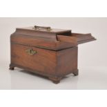 A George III mahogany sarcophagus shape tea caddy, with herring bone stringing,