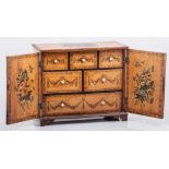 A George III satinwood and simulated satinwood table cabinet, with herringbone stringing,