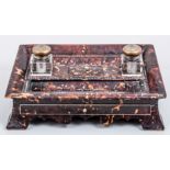 A William IV tortoiseshell desk stand, rectangular shape with a dished top,