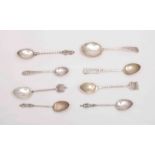 A collection of Edwardian and later silver souvenir spoons.