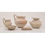 A Greco-Roman wheel made white painted ware juglet, decorated with concentric bands,