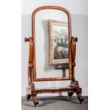 A Victorian mahogany cheval mirror, arched plate, scrolled supports, serpentine platform,