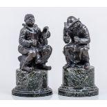 A pair of bronze tavern figures, after David Teniers, each figure seated,