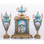 A three piece Sevres style bleu celeste and gilt metal matched three piece clock garniture,