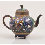 A Chinese cloisonne ovoid tea pot, black ground with lapettes, filled with butterflies and flowers,