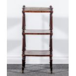 A Regency rosewood three tier whatnot, in the manner of Gillow's of Lancaster,