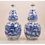 A pair of Chinese blue and white double gourd shape vases, bearing Kangxi four character mark,