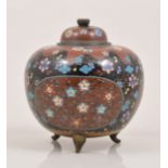 A Japanese cloisonne green ground baluster shape covered vase, decorated with a phoenix and flowers,