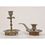 A champleve enamel brass and alabaster faced candlestick, slender ringed column , shaped platform,