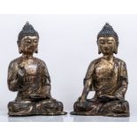 A pair of Sino-Tibetan copper-gilt figures of Buddha, the robes matching, both seated in dhyanasana,