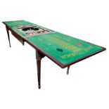 An Edwardian mahogany games table, rectangular double foldover top with a moulded edge,