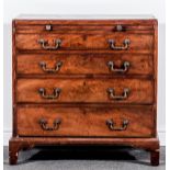 A George III mahogany chest of drawers, rectangular top with a rounded edge,