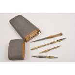 Three pairs of brass microscope tweezers, two with elbow joints, one fixed with a turned handle,