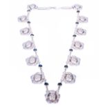 A Georg Jensen sterling silver necklace, thirteen circular floral links, spaced by bars,