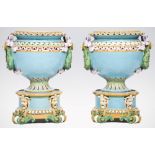A pair of large Minton majolica jardinieres and stands, pedestal urn shape with moulded decoration,