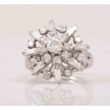 A diamond set snowflake design open cluster ring, central brilliant cut diamond,